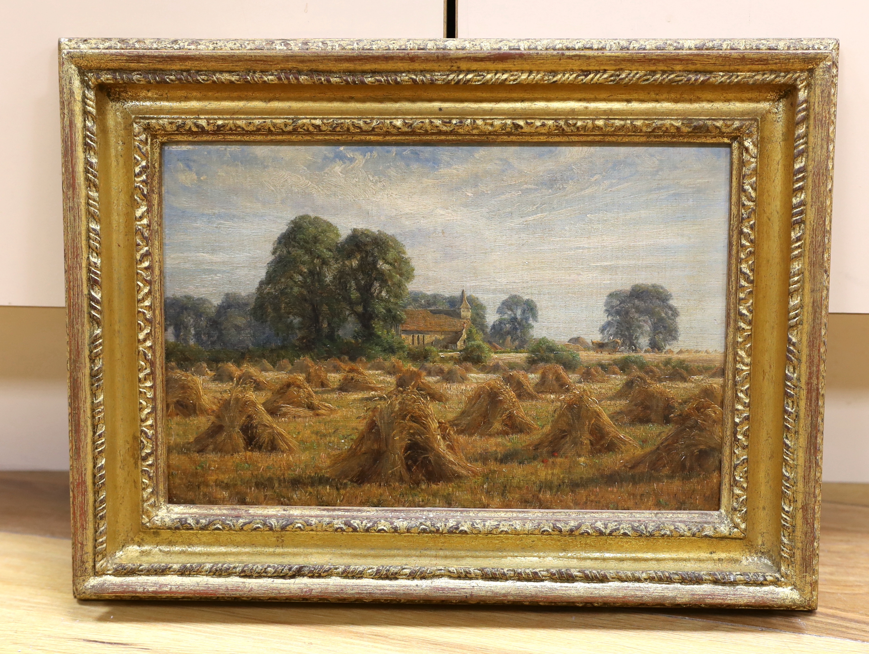 Alfred East RA, (1849-1913) oil on board, Harvesting, initialled and dated 1901, 28cm x 19cm